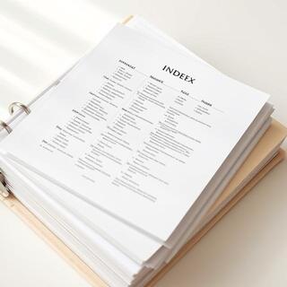 Monthly notes clipped inside a ring binder