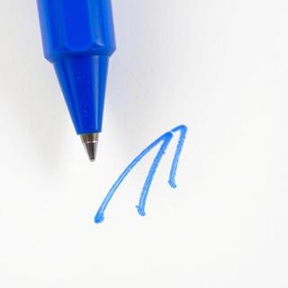 Blue ballpoint strokes on ivory paper