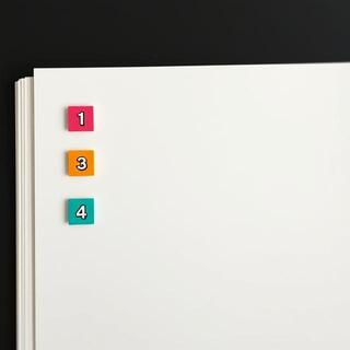 Three colored tabs indexing a planner