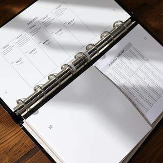 Notes archived inside a ring binder with dividers